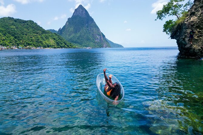 Clear Kayak Drone Photoshoot in St. Lucia - A clear kayak with the Pitons behind you
