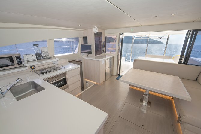 Private Half-Day Luxury Catamaran Experience - Swimming, snorkeling, and a beach stop