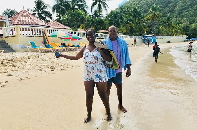 Reduit Beach Round-Trip Shuttle Service - Arriving at Reduit Beach with a welcome drink